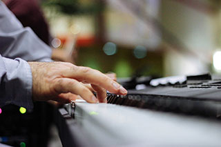 man playing a keyboard