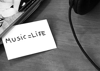 music headphones and a note that says music equals life